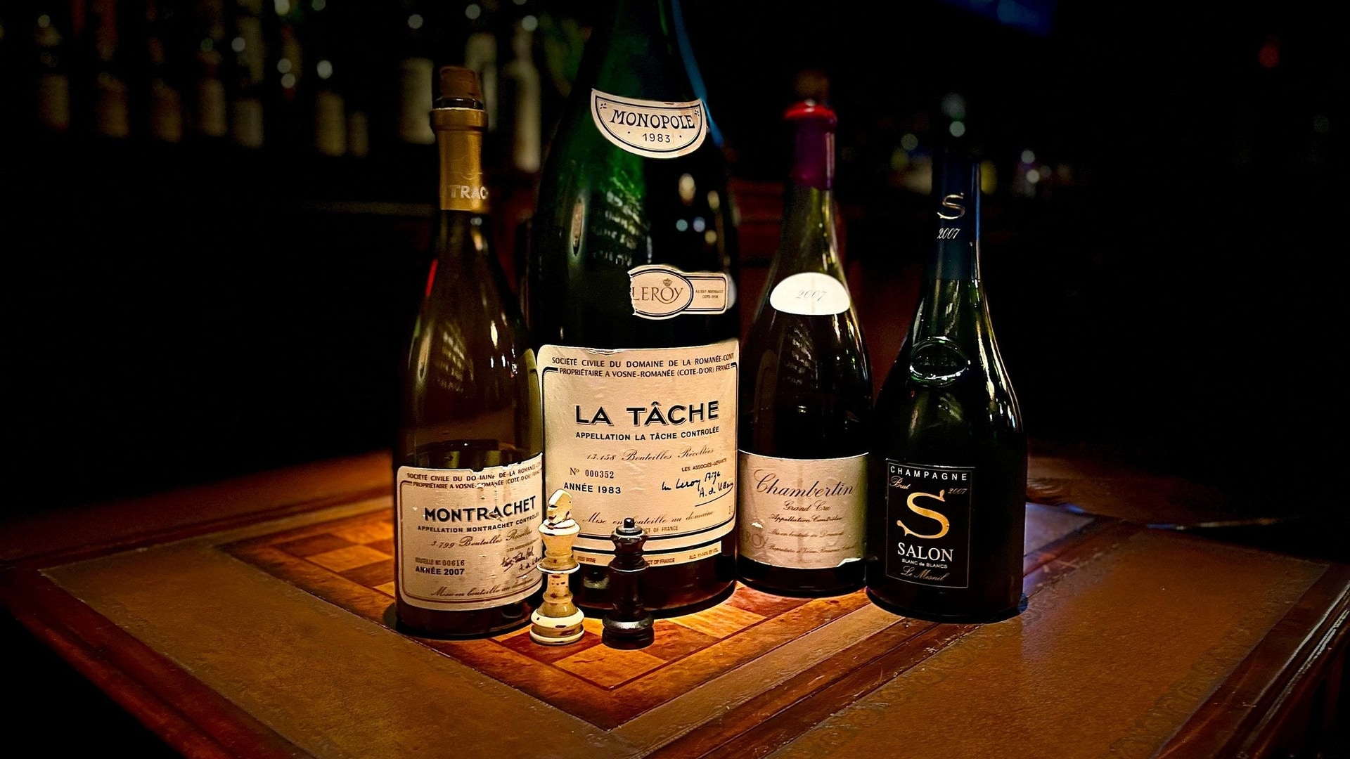 DRC and Burgundy grand cru bottles in a cellar setting